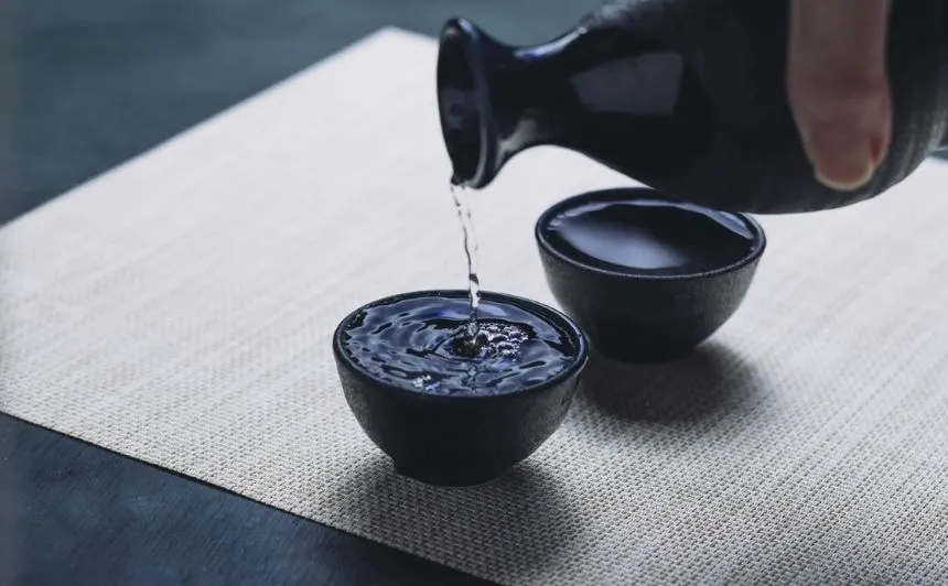 Sake being poured into a cup